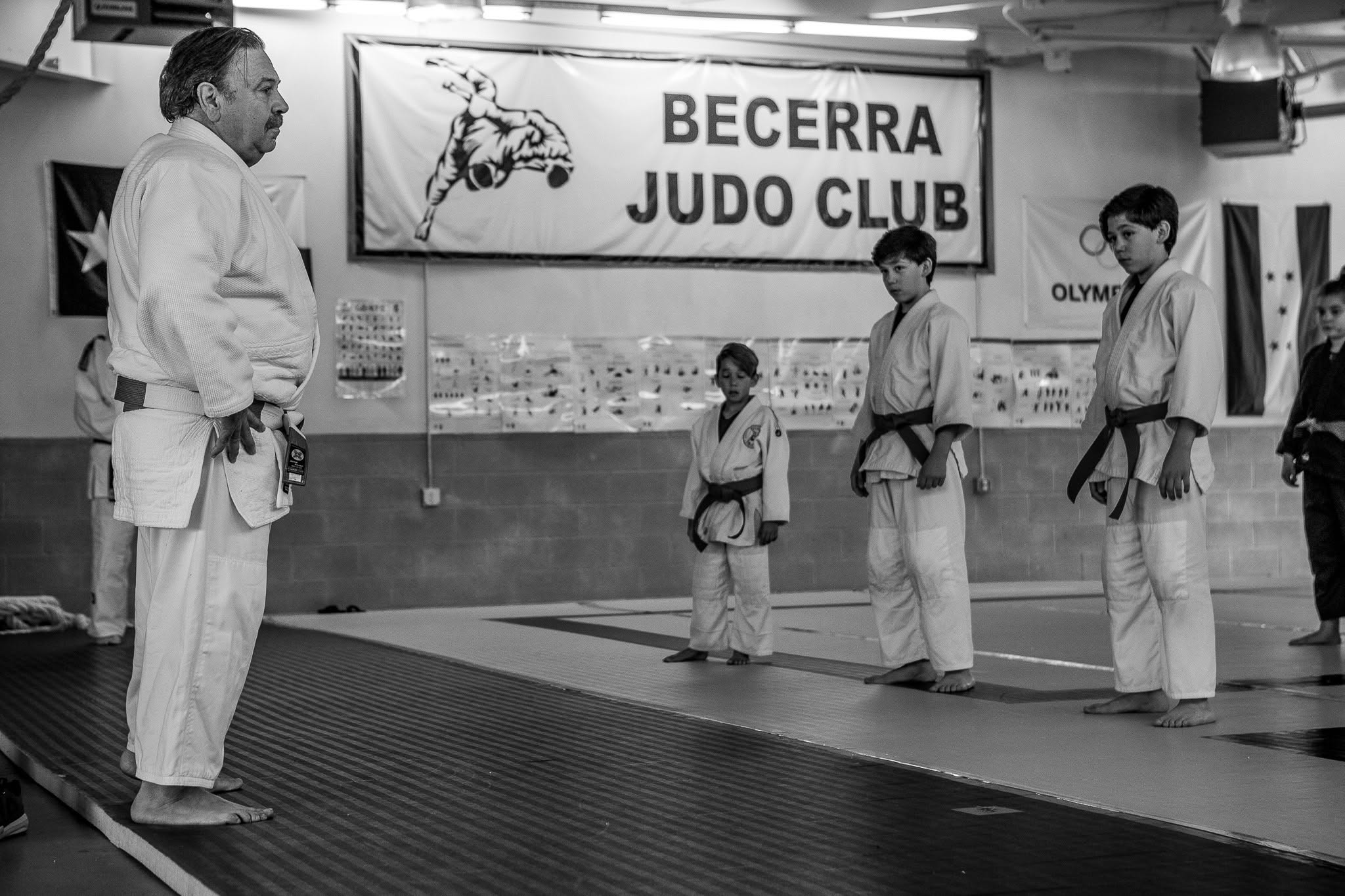 A Becerra Judo instructor leading students on the mat