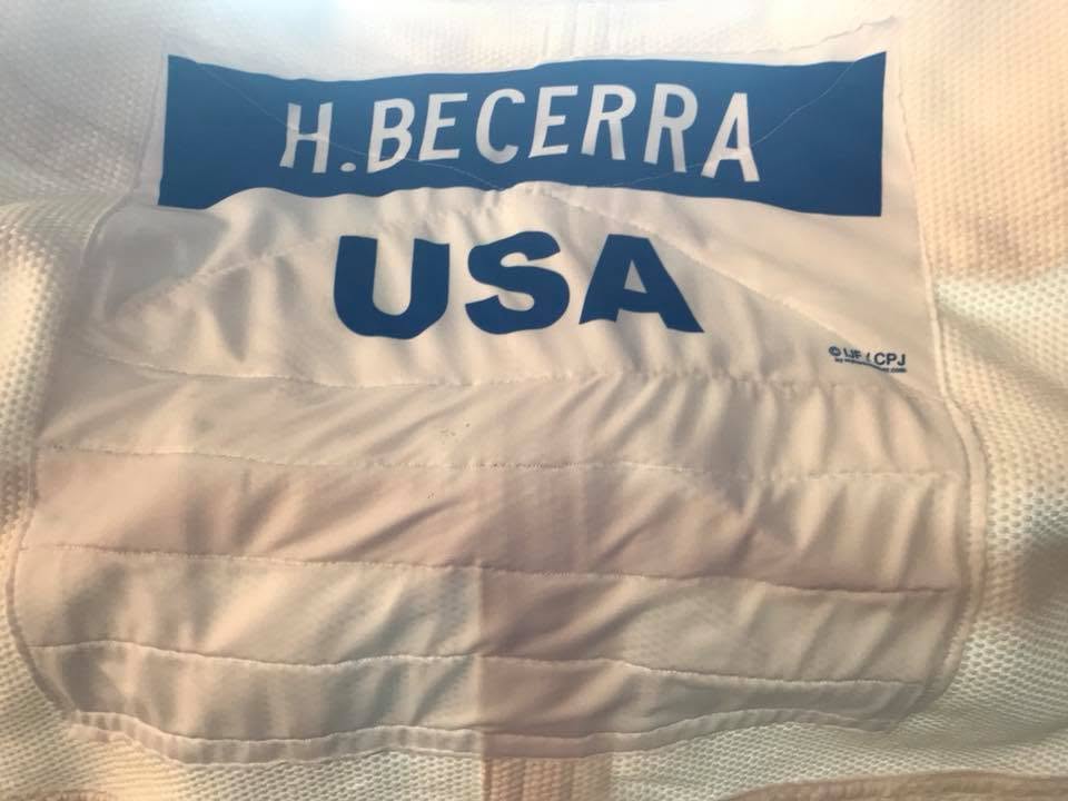 A judo uniform bearing the name H. Becerra and USA
